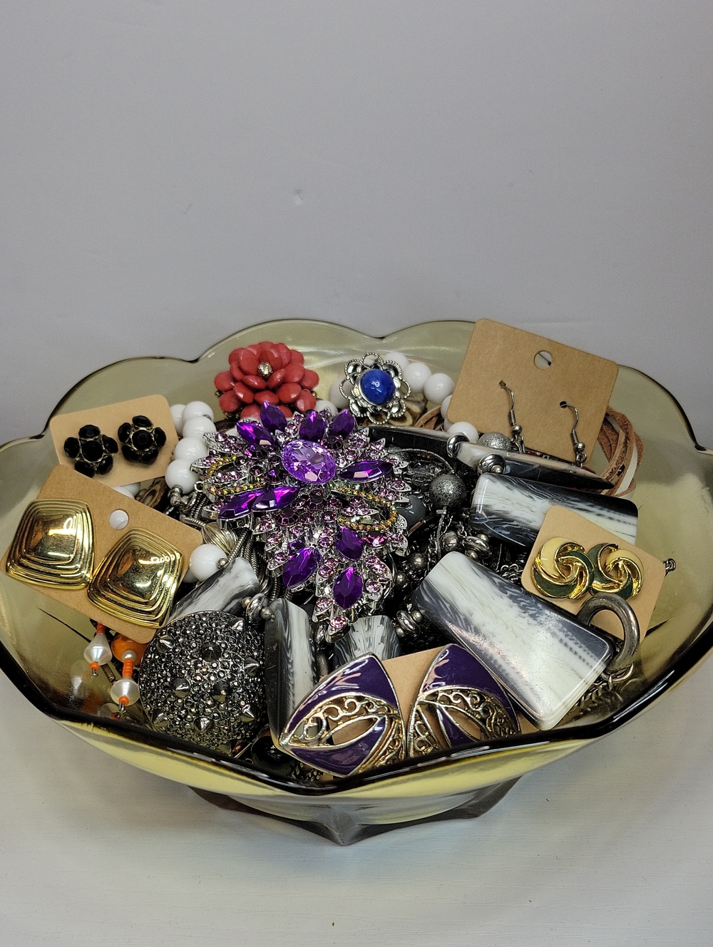 Assorted Jewelry In A Glass Dish